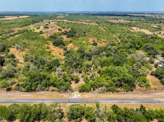 a view of a field with an outdoor space