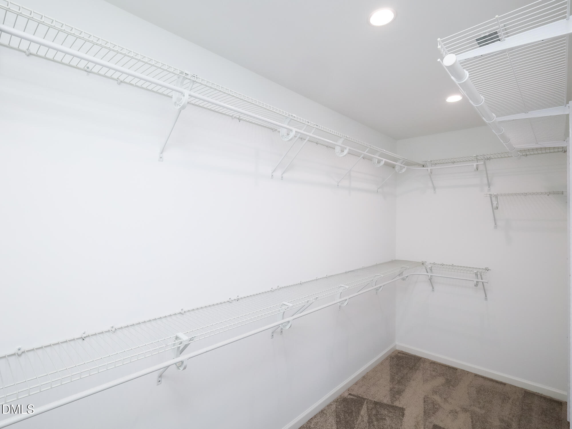 1314 Still Monument Way Raleigh, NC 27603 - Photo 15 of 25 a view of a room with racks on the wall