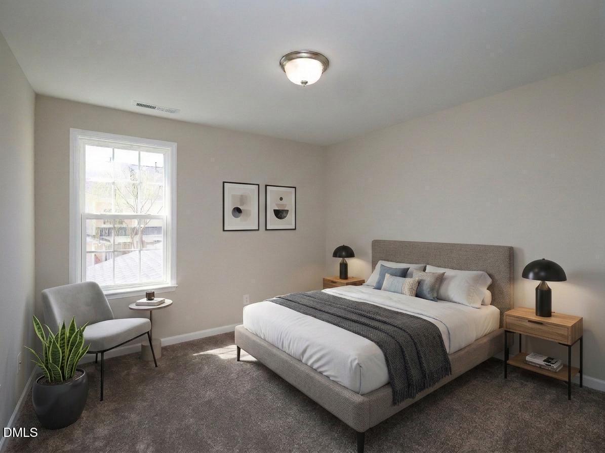 1314 Still Monument Way Raleigh, NC 27603 - Photo 17 of 25 a bedroom with a bed and a couch