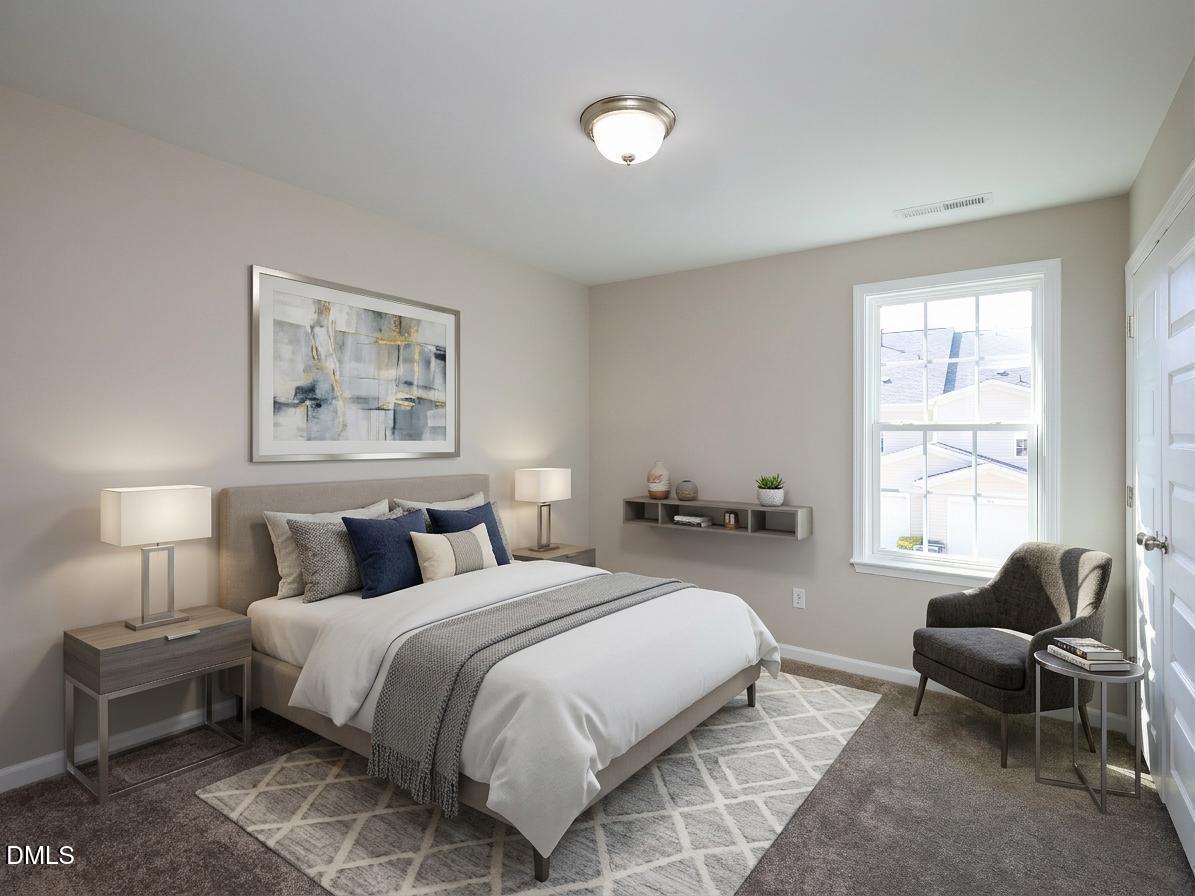 1314 Still Monument Way Raleigh, NC 27603 - Photo 18 of 25 a bedroom with a bed and a couch