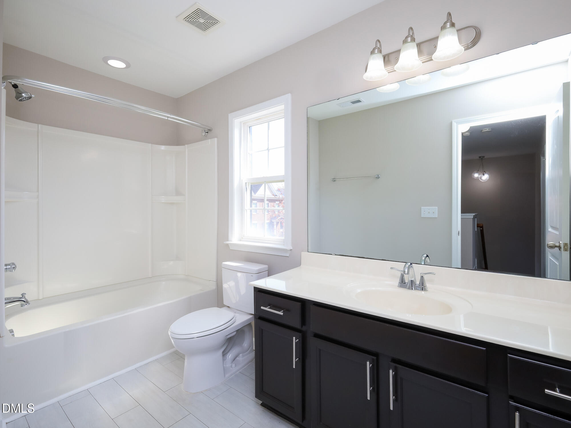 1314 Still Monument Way Raleigh, NC 27603 - Photo 19 of 25 a bathroom with a sink a toilet and shower