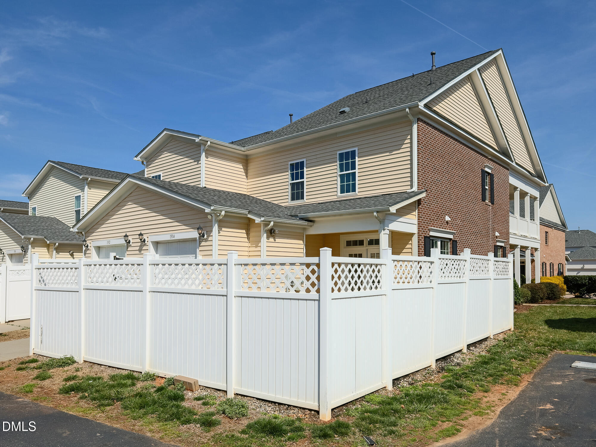1314 Still Monument Way Raleigh, NC 27603 - Photo 22 of 25 a view of a house with a small yard and wooden fence