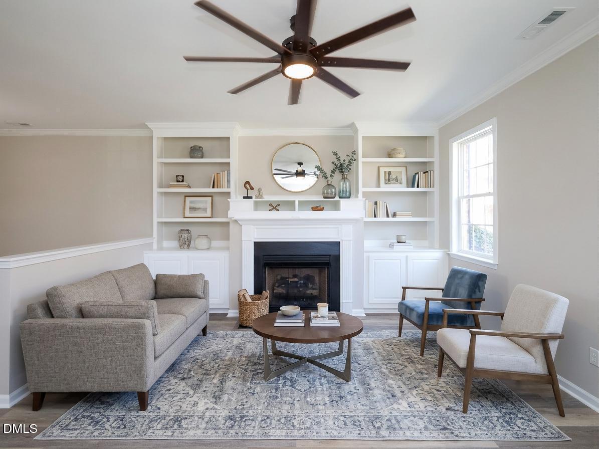 1314 Still Monument Way Raleigh, NC 27603 - Photo 4 of 25 a living room with furniture and a fireplace