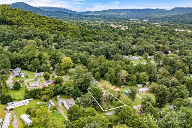 an aerial view of residential house with outdoor space and street view