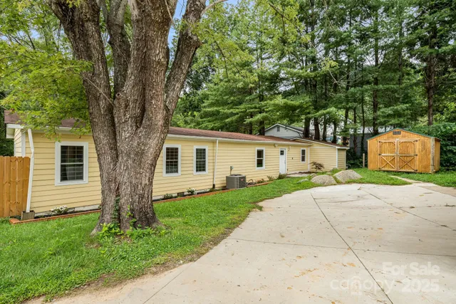 a front view of a house with a yard and a garage