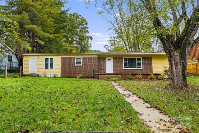 front view of a house with a yard
