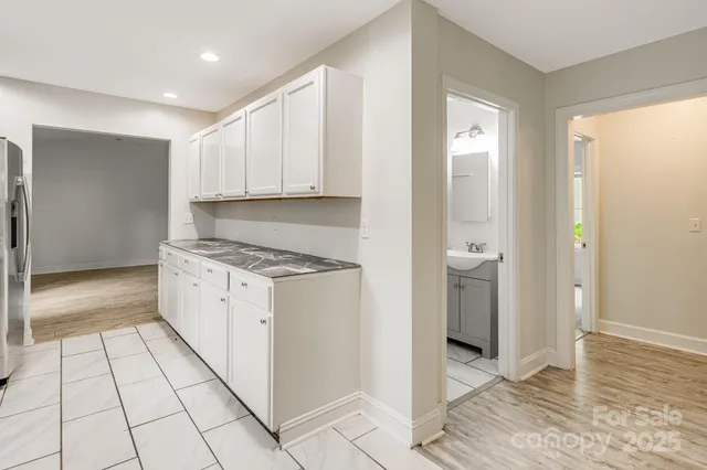 a view of a kitchen with electric appliances