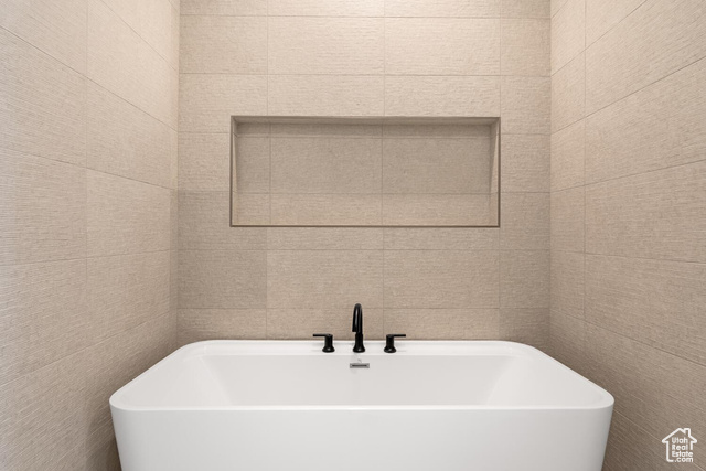 5367 Cyan Lane St. George, UT 84790 - Photo 34 of 36 Full bath featuring a freestanding bath and tile walls