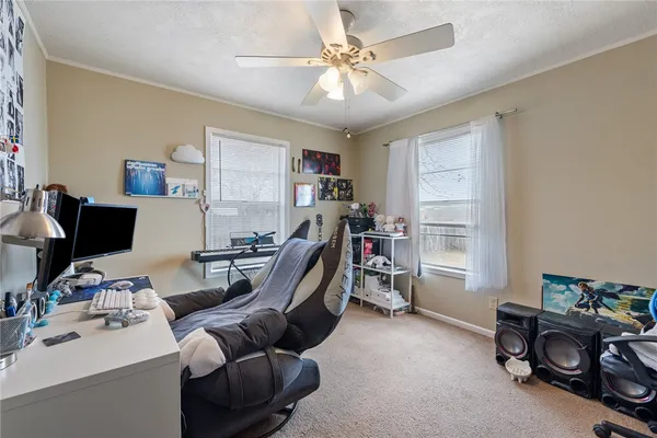 a bedroom with furniture and a window