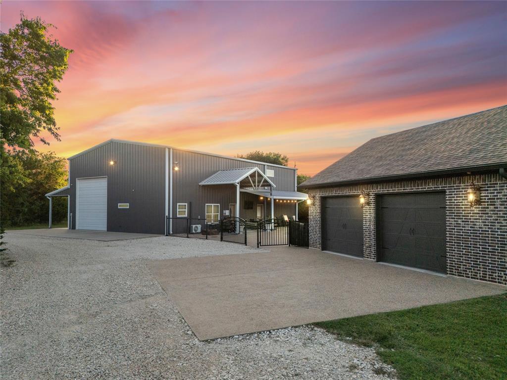 18503 Wortham Bend Road China Spring, TX 76633 - Photo 33 of 40 a front view of a house with a yard and garage