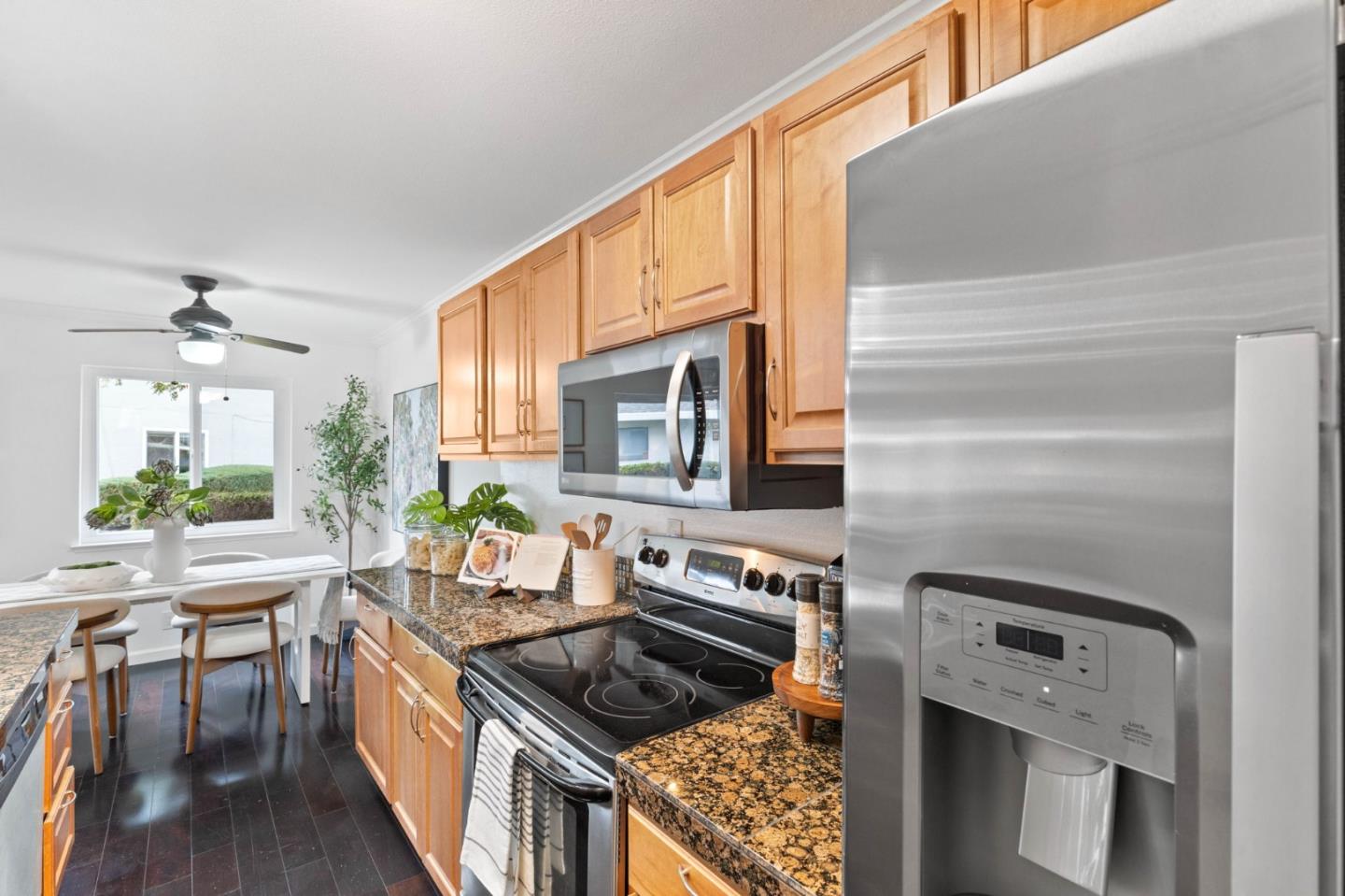 5536 Spinnaker Drive, Unit 3 San Jose, CA 95123 - Photo 20 of 30 a kitchen with stainless steel appliances granite countertop a stove and a microwave