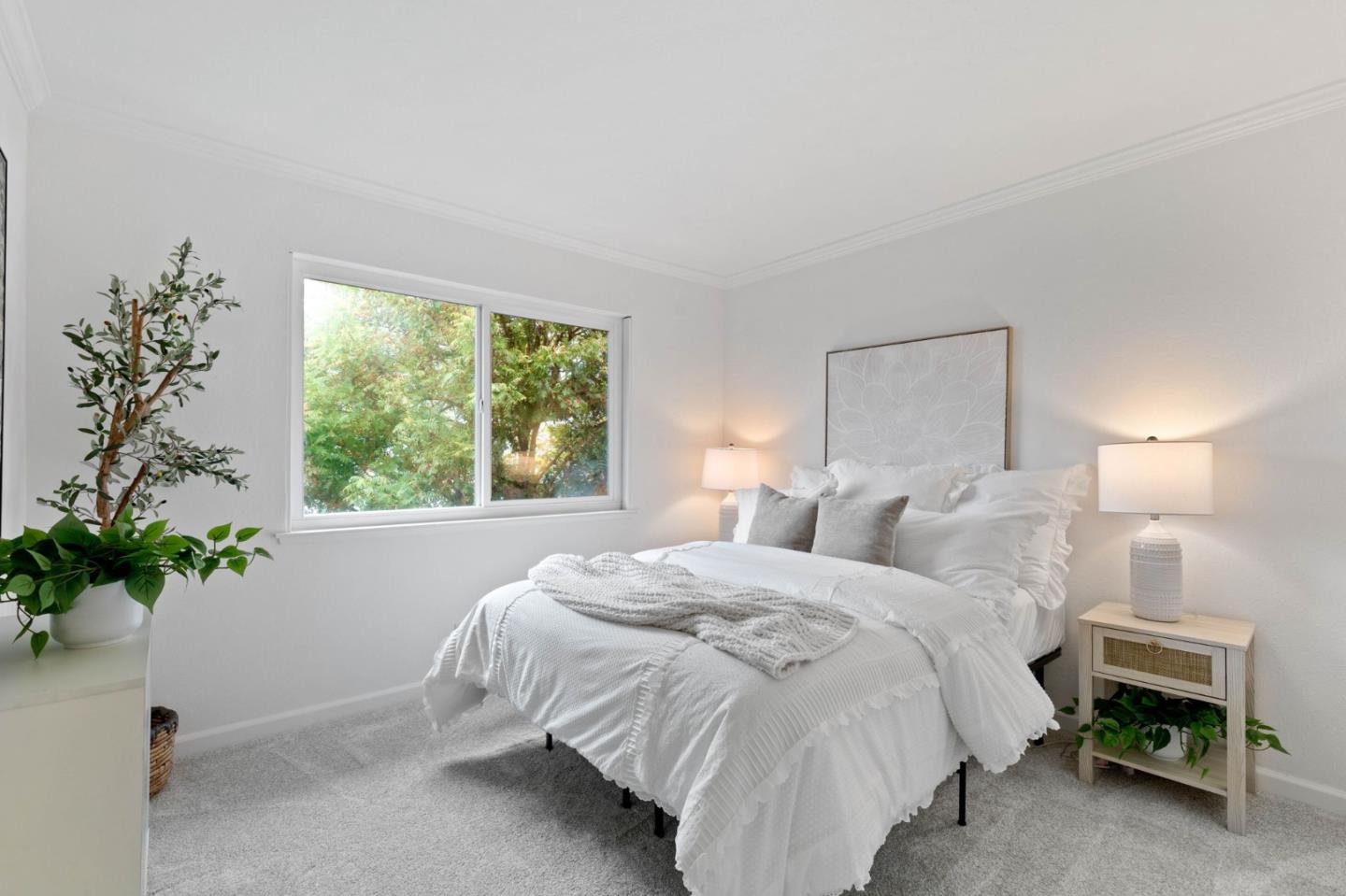 5536 Spinnaker Drive, Unit 3 San Jose, CA 95123 - Photo 24 of 30 a bedroom with a bed and a potted plant
