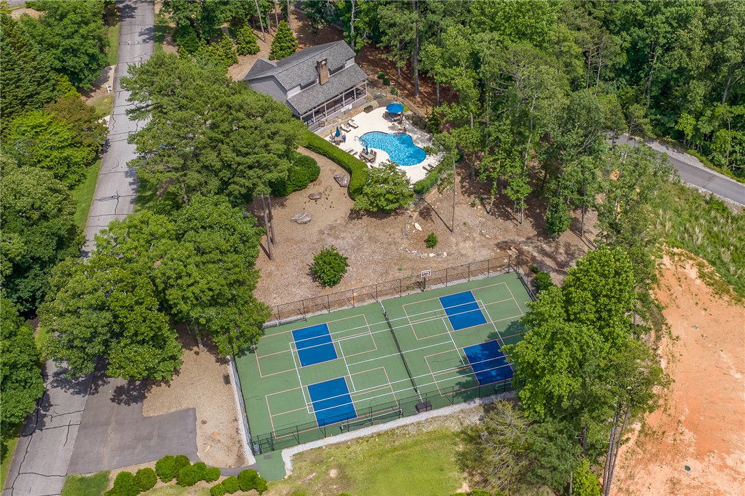 118 Beacon Ridge Circle Salem, SC 29676 - Photo 40 of 45 An aerial view captures the inviting pool and adjacent tennis court, promising endless outdoor enjoyment.