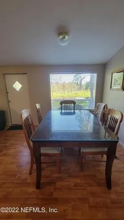 a view of a tables and chairs in a room
