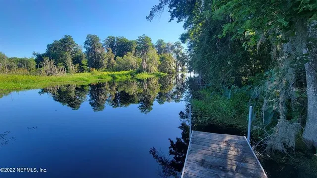 a view of a lake with a yard