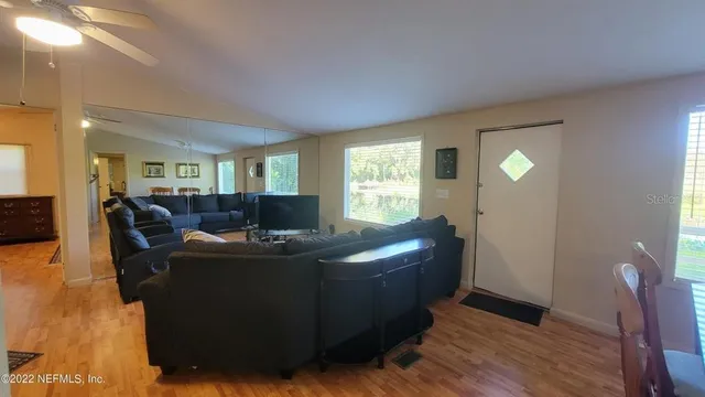 a living room with furniture and a window