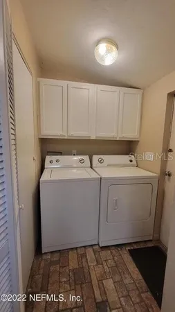 a utility room with dryer and washer