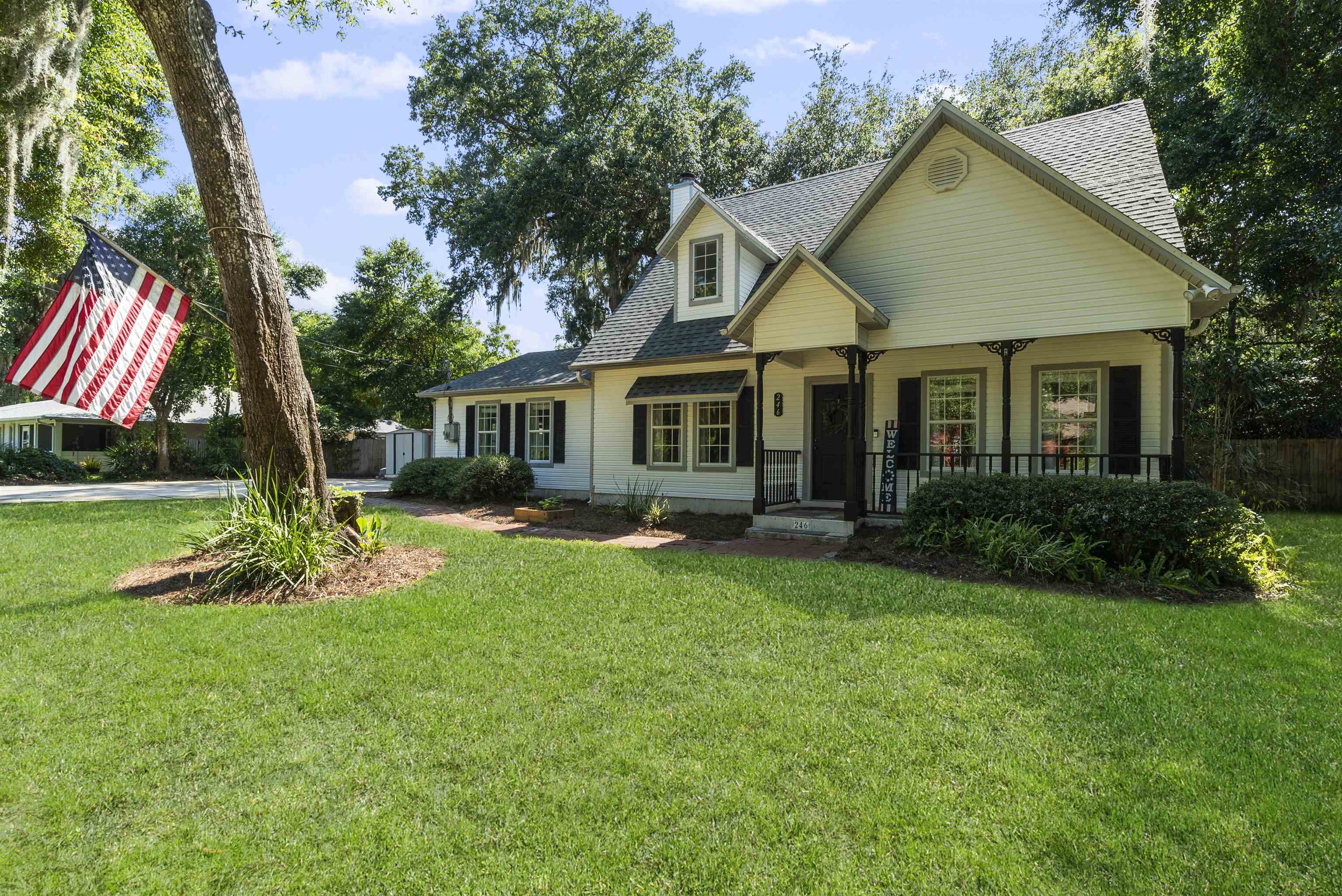 246 Mimosa Road St. Augustine, FL 32086 - Photo 1 of 45 a view of a house with a yard patio and a garden