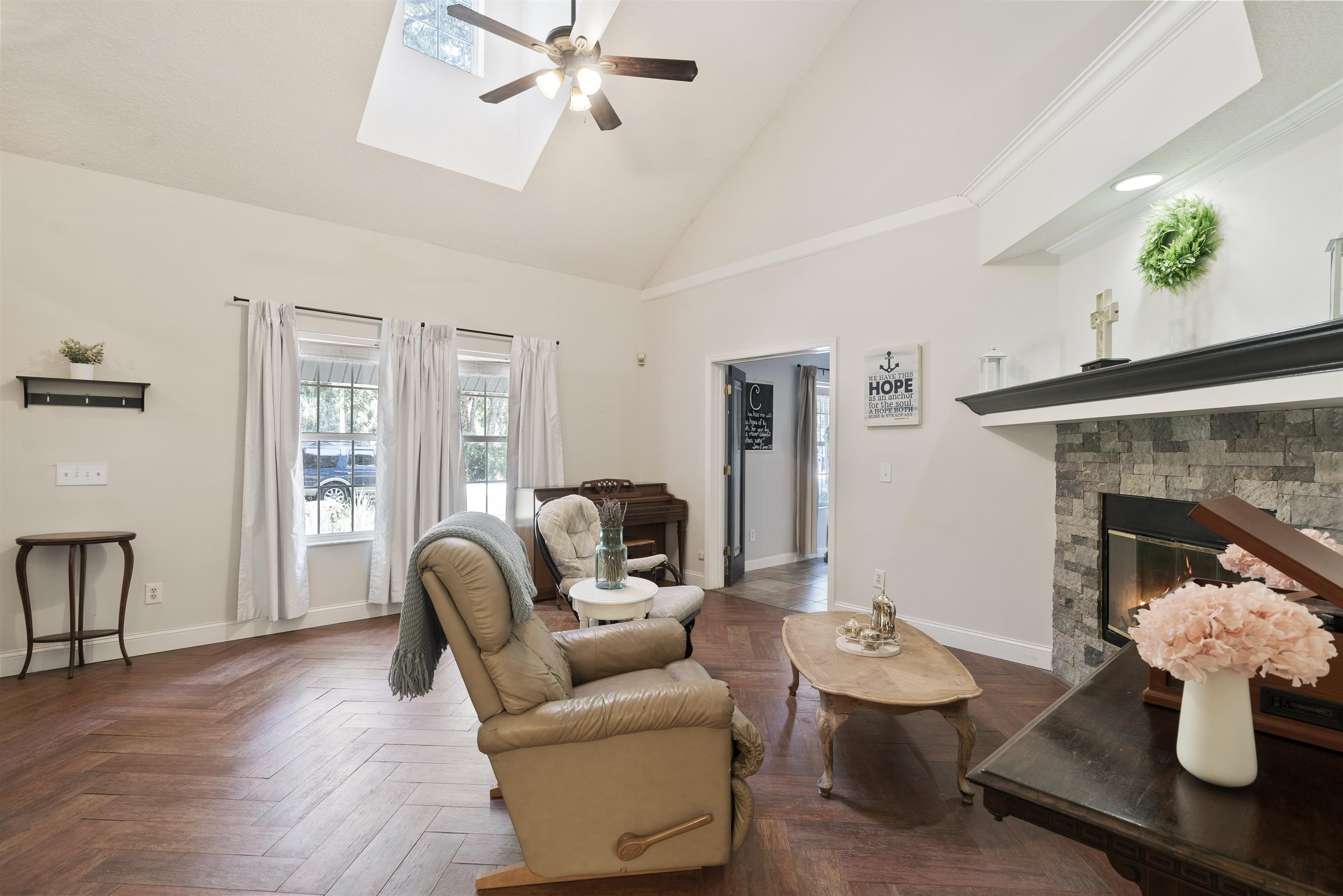 246 Mimosa Road St. Augustine, FL 32086 - Photo 15 of 45 a living room with furniture and a fireplace