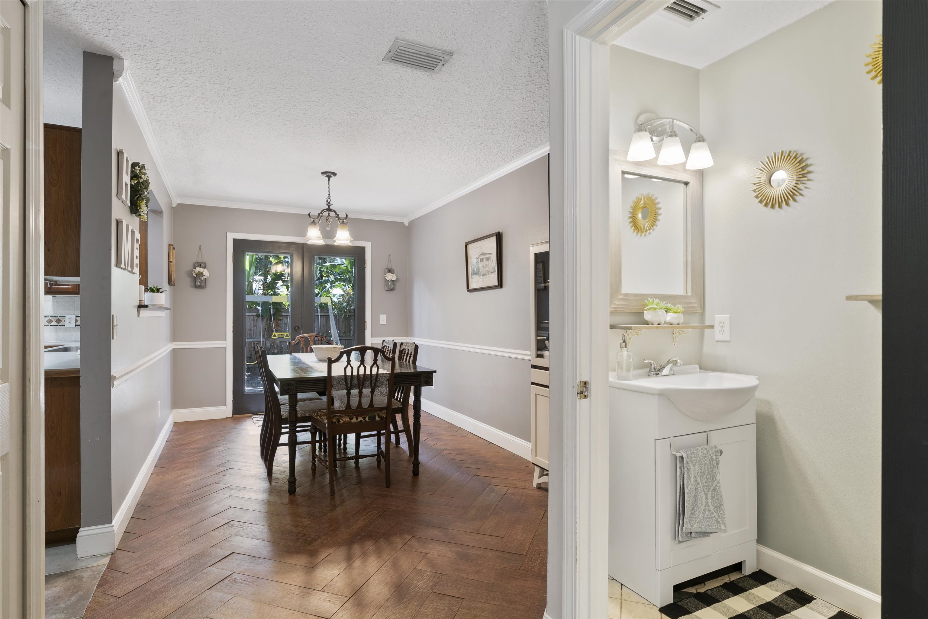 246 Mimosa Road St. Augustine, FL 32086 - Photo 18 of 45 a view of a dining room with furniture window and wooden floor