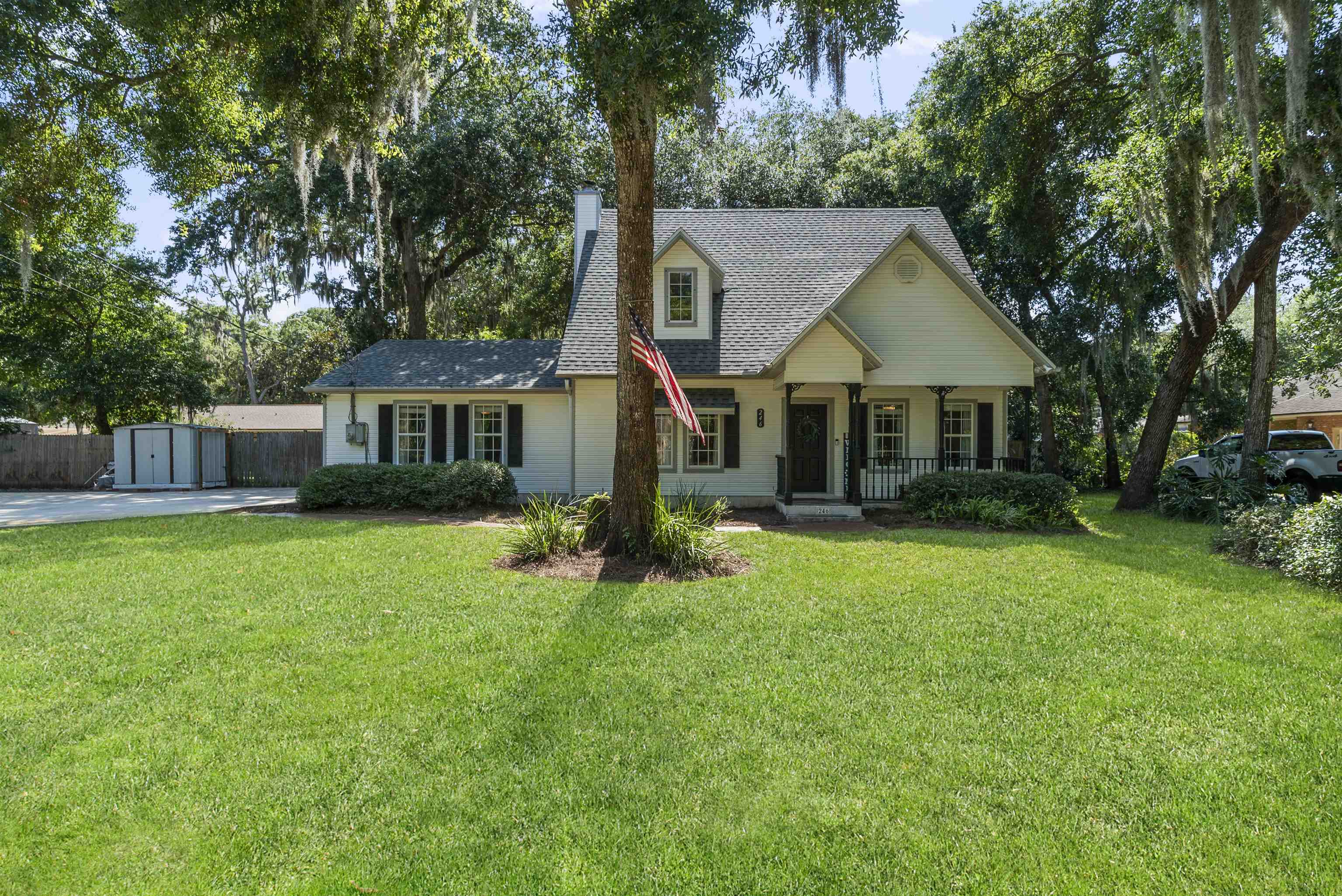 246 Mimosa Road St. Augustine, FL 32086 - Photo 2 of 45 a front view of a house with a yard and trees
