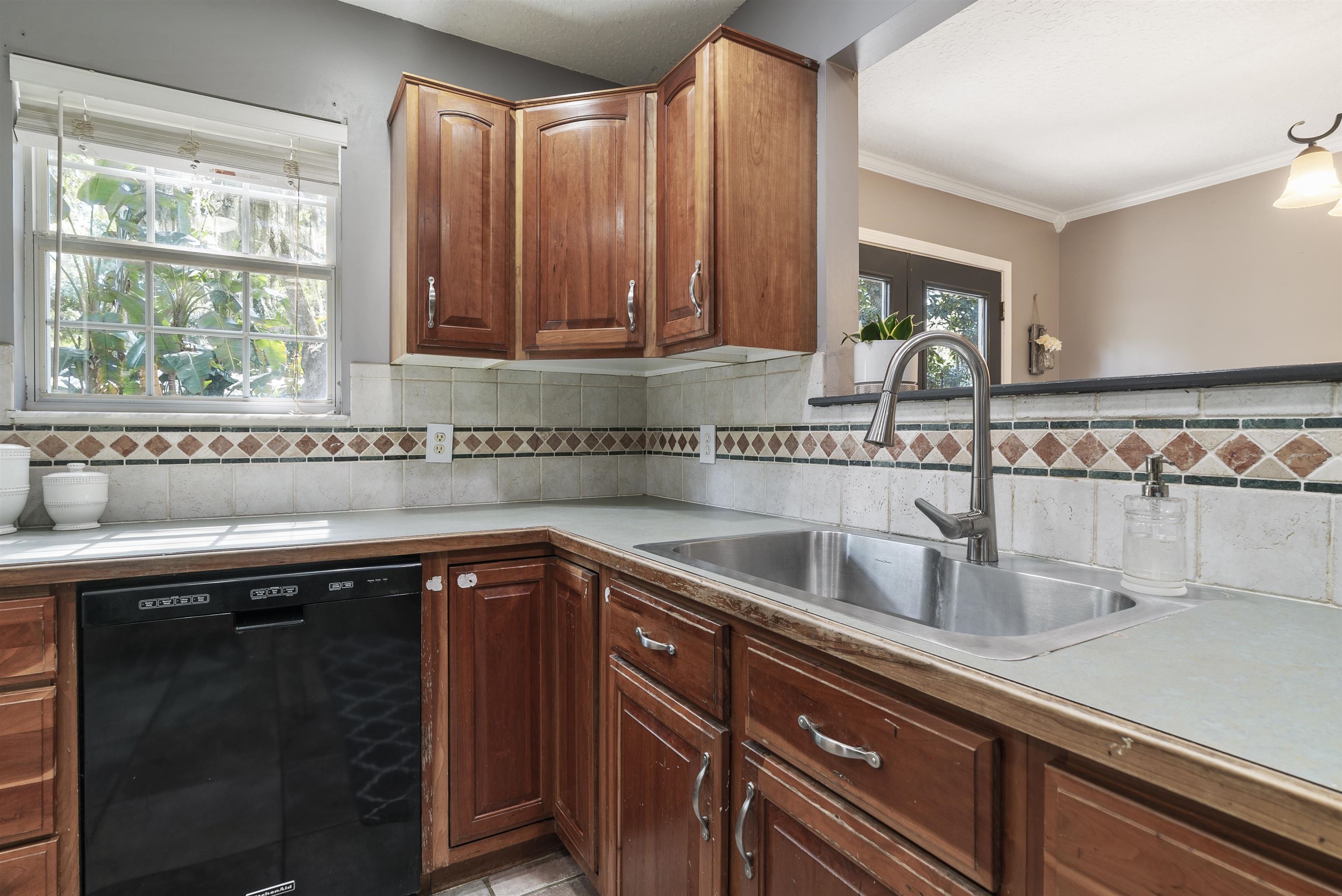 246 Mimosa Road St. Augustine, FL 32086 - Photo 21 of 45 a kitchen with a sink and cabinets