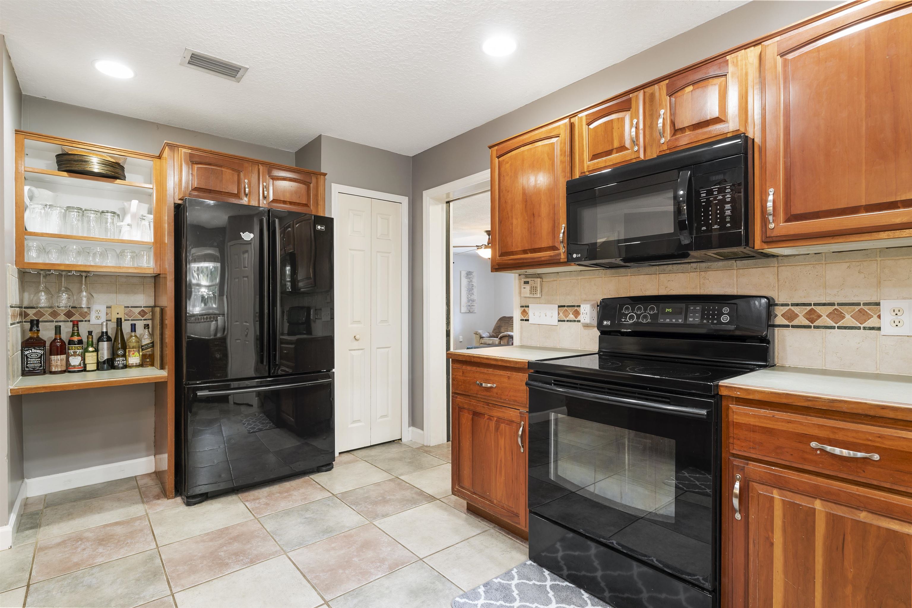 246 Mimosa Road St. Augustine, FL 32086 - Photo 23 of 45 a kitchen with a refrigerator stove and microwave