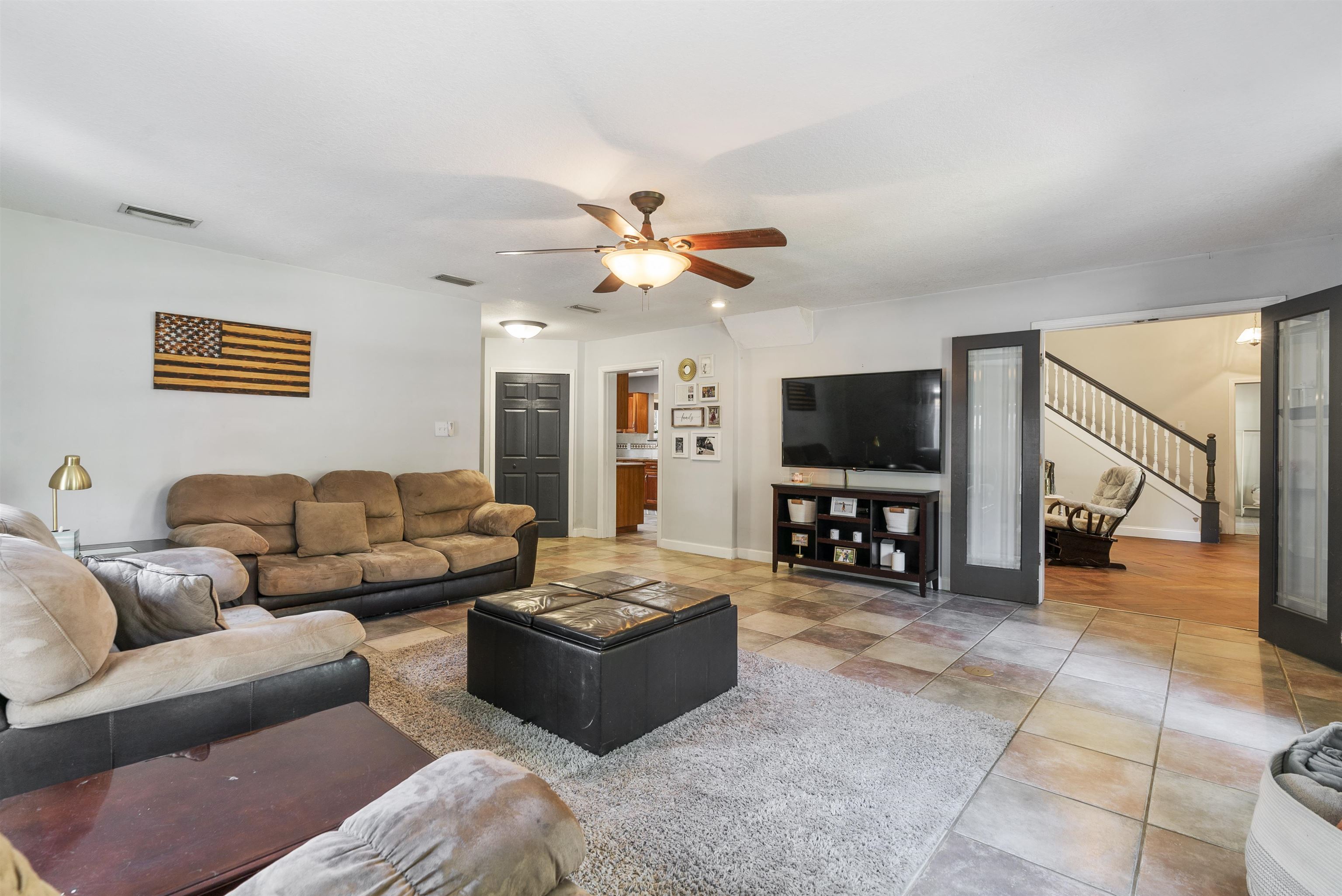 246 Mimosa Road St. Augustine, FL 32086 - Photo 24 of 45 a living room with furniture and a flat screen tv