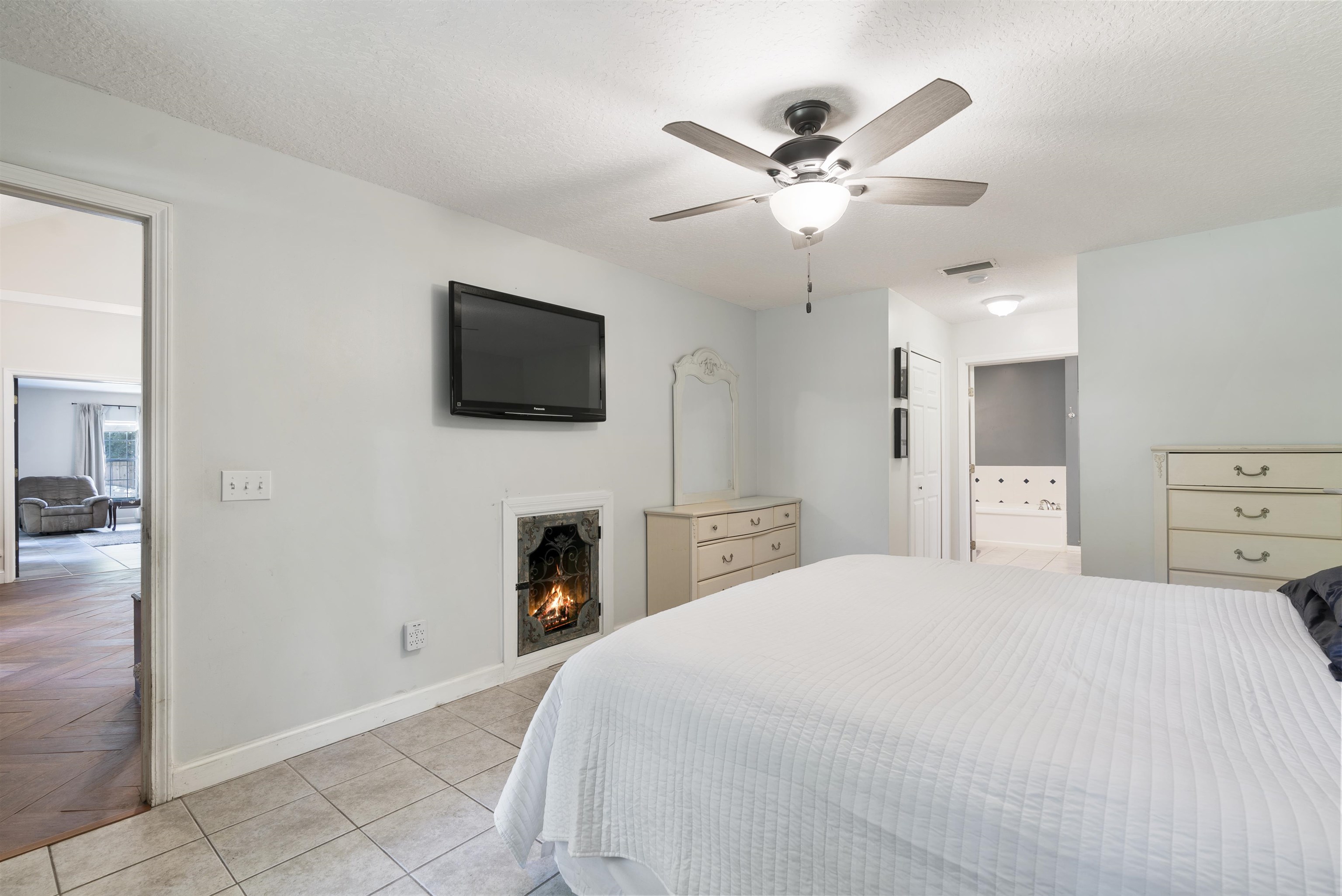 246 Mimosa Road St. Augustine, FL 32086 - Photo 29 of 45 a bedroom with a bed and a flat screen tv