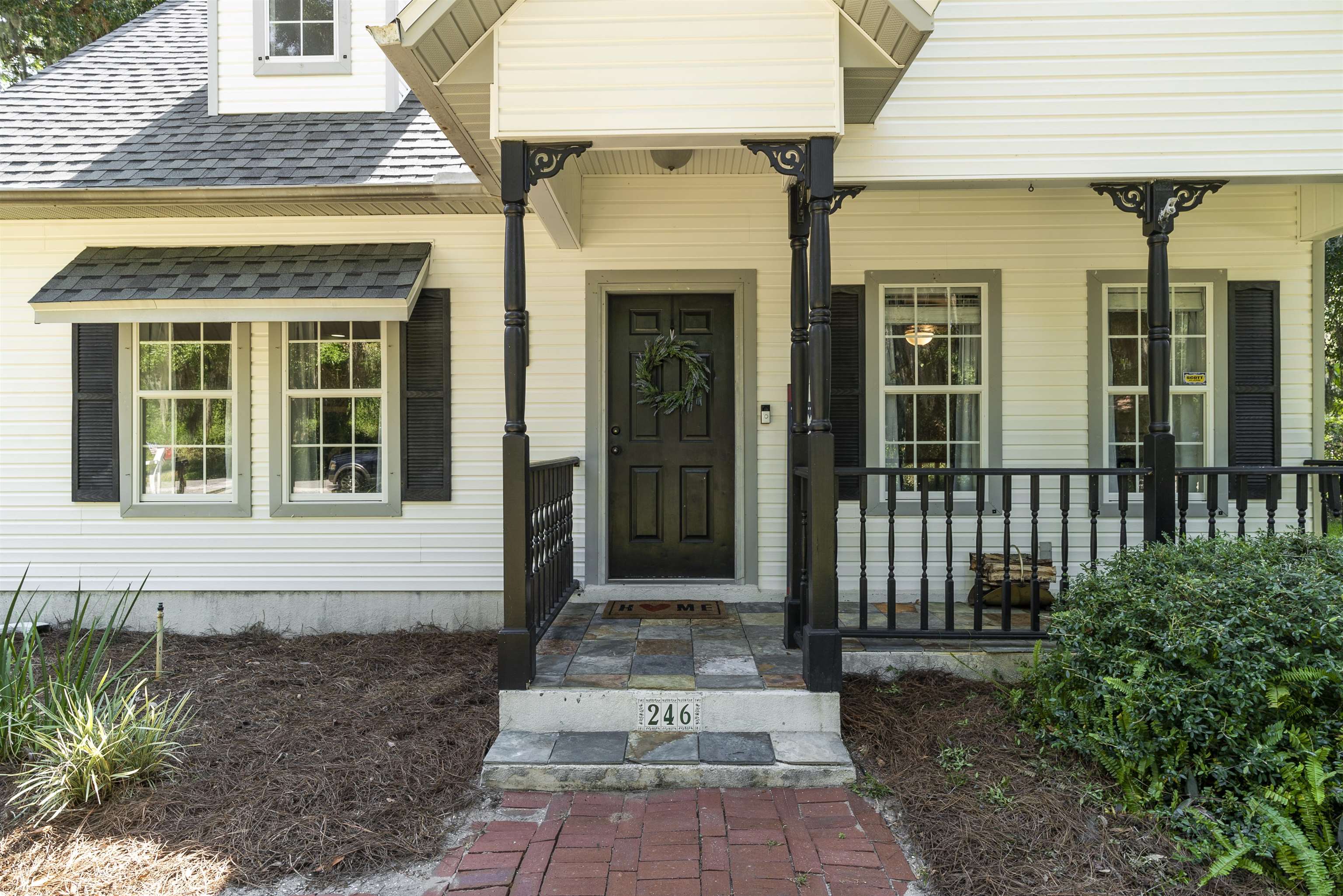 246 Mimosa Road St. Augustine, FL 32086 - Photo 3 of 45 a front view of a house with a porch