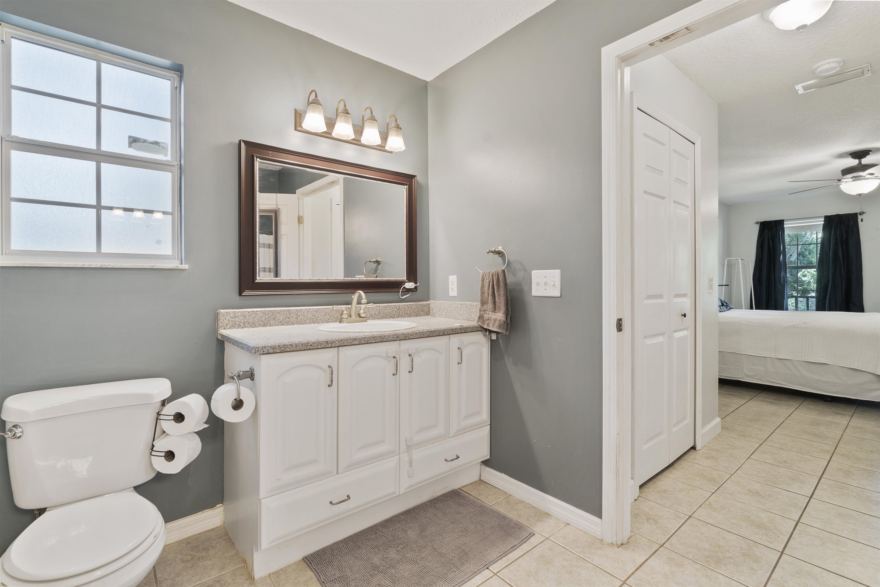 246 Mimosa Road St. Augustine, FL 32086 - Photo 31 of 45 a bathroom with a toilet sink and mirror