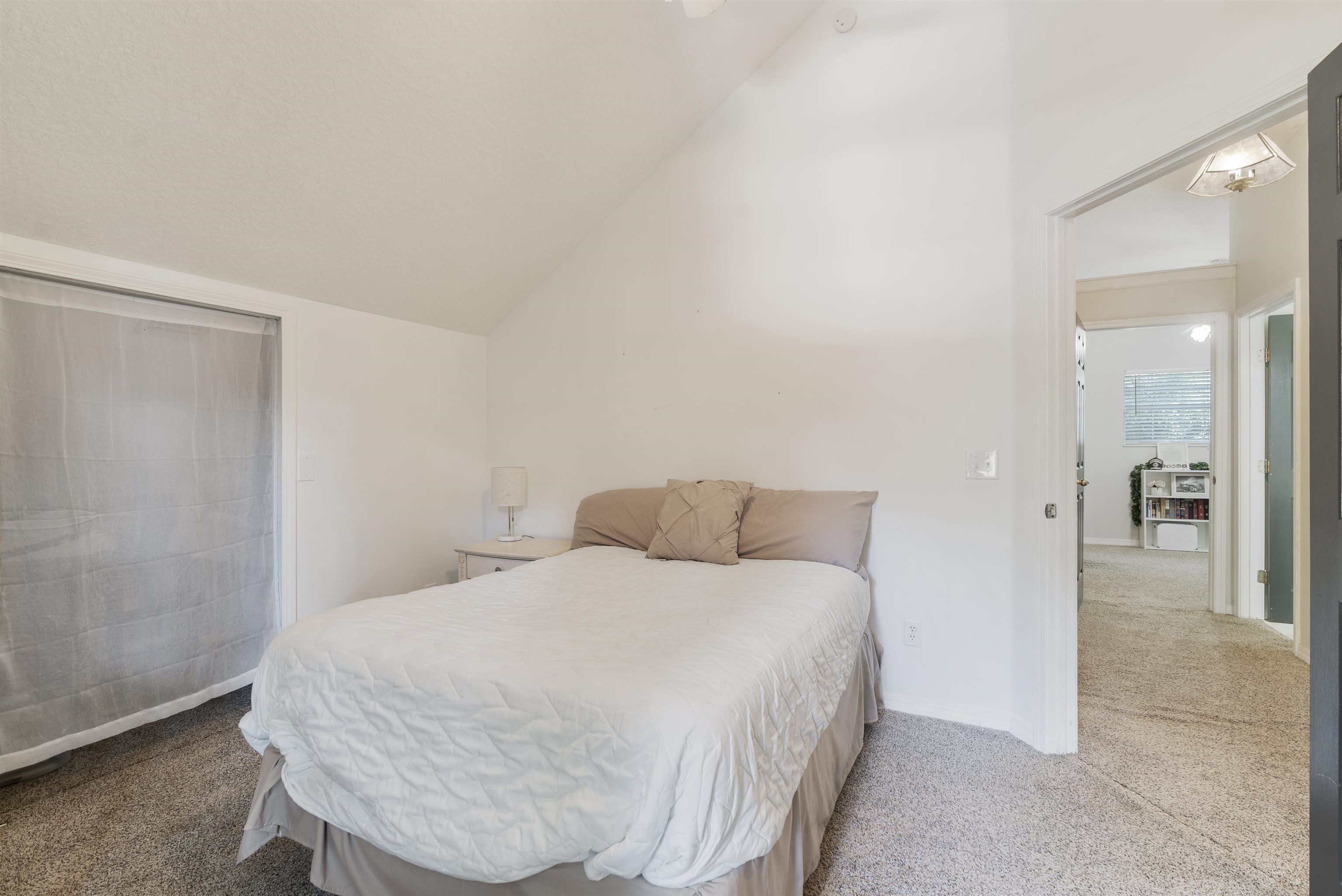 246 Mimosa Road St. Augustine, FL 32086 - Photo 36 of 45 a bedroom with a bed and a mirror