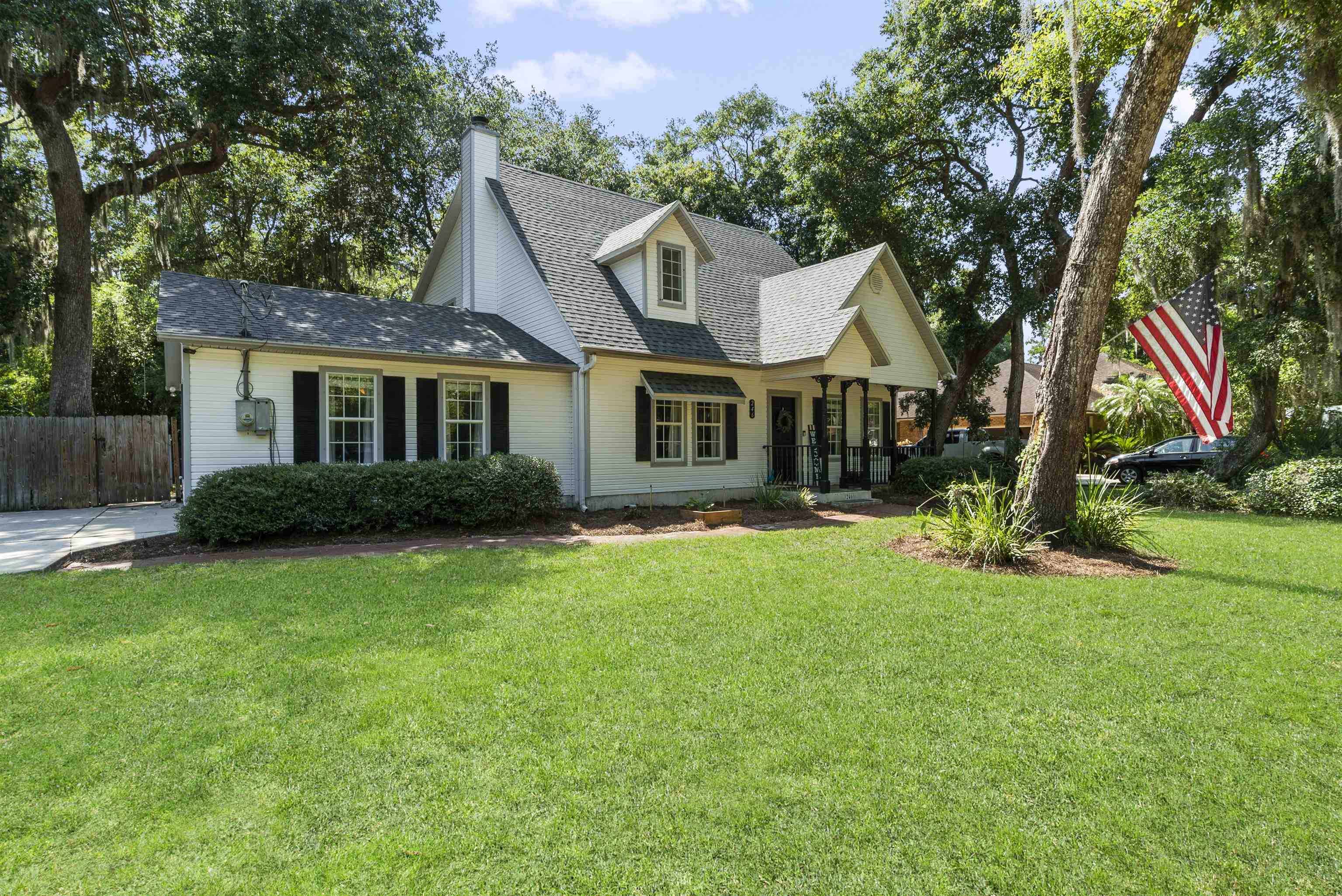 246 Mimosa Road St. Augustine, FL 32086 - Photo 4 of 45 a front view of a house with a yard
