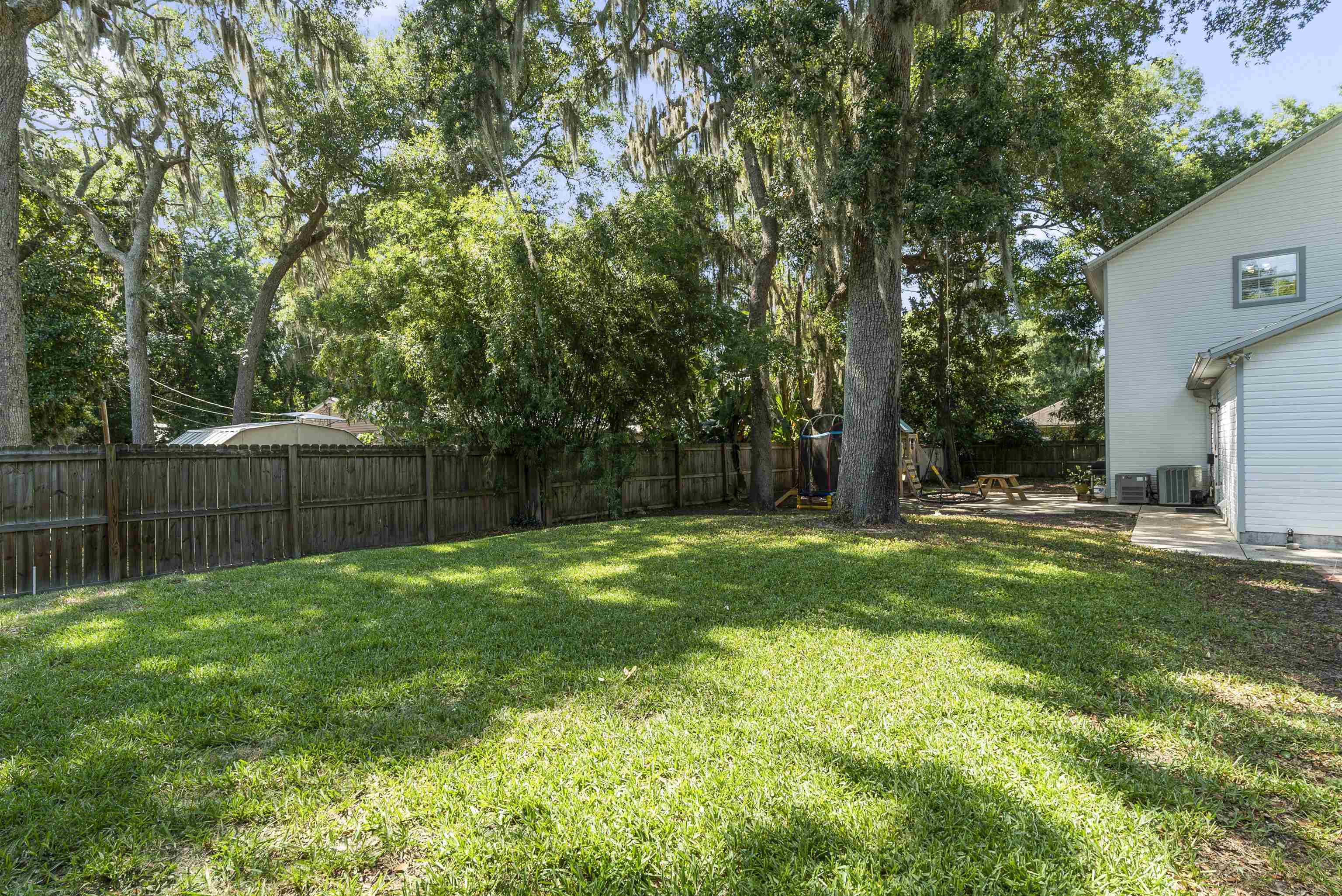 246 Mimosa Road St. Augustine, FL 32086 - Photo 42 of 45 a view of a backyard with large trees