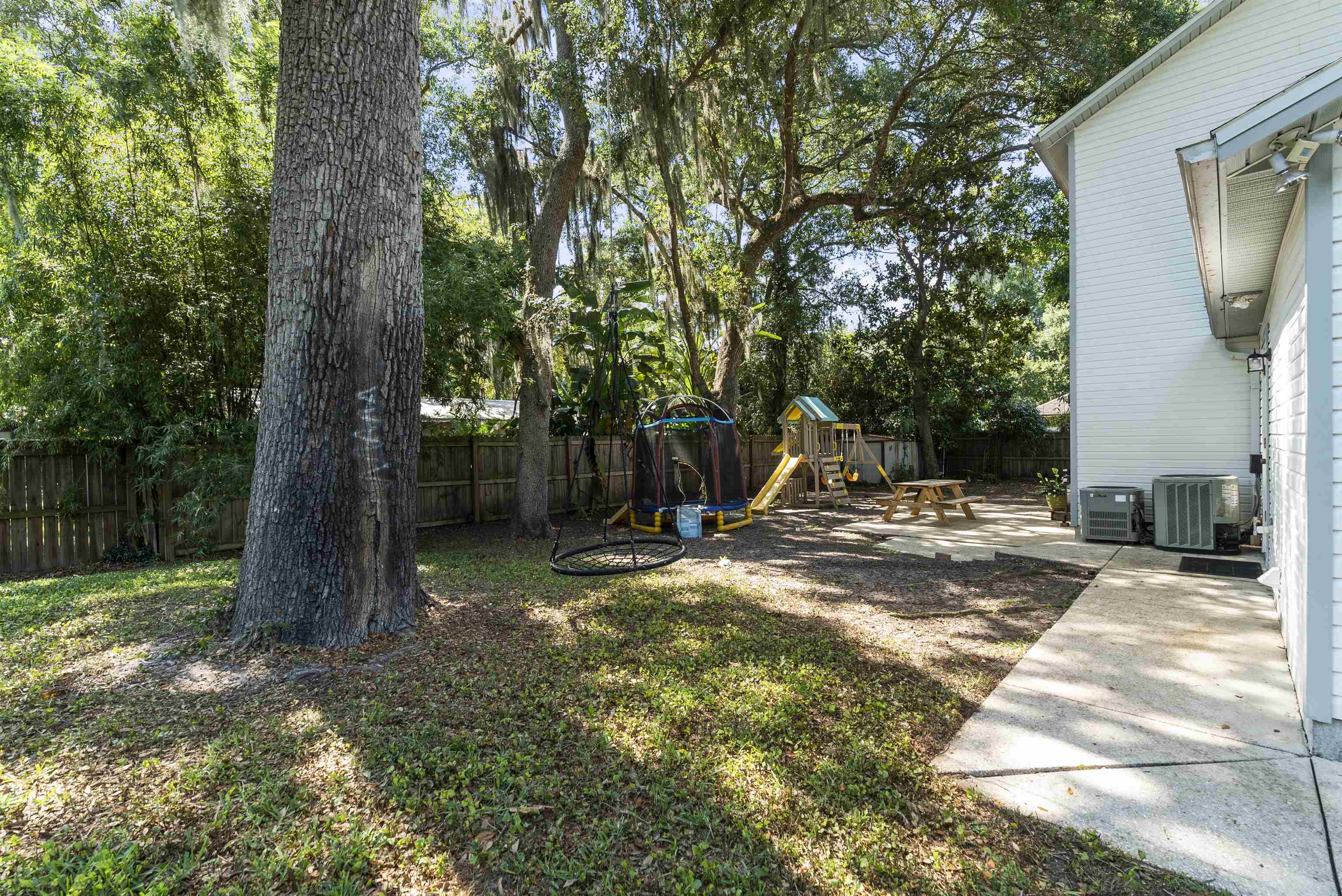 246 Mimosa Road St. Augustine, FL 32086 - Photo 44 of 45 a view of a backyard with large tree