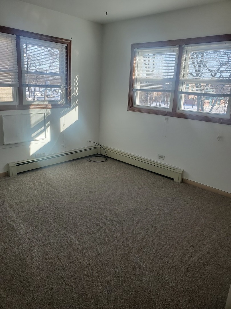 508 Ida Court, Unit 2 Mount Prospect, IL 60056 - Photo 11 of 13 an empty room with a window