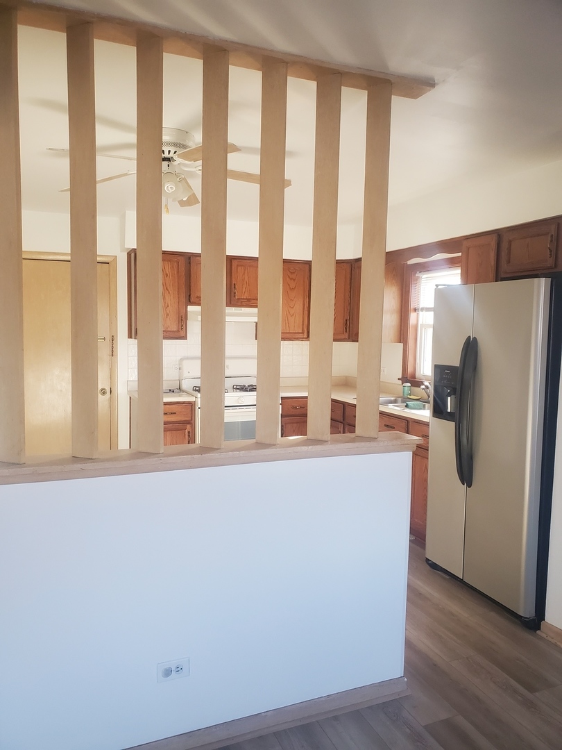 508 Ida Court, Unit 2 Mount Prospect, IL 60056 - Photo 4 of 13 a white refrigerator freezer sitting in a kitchen