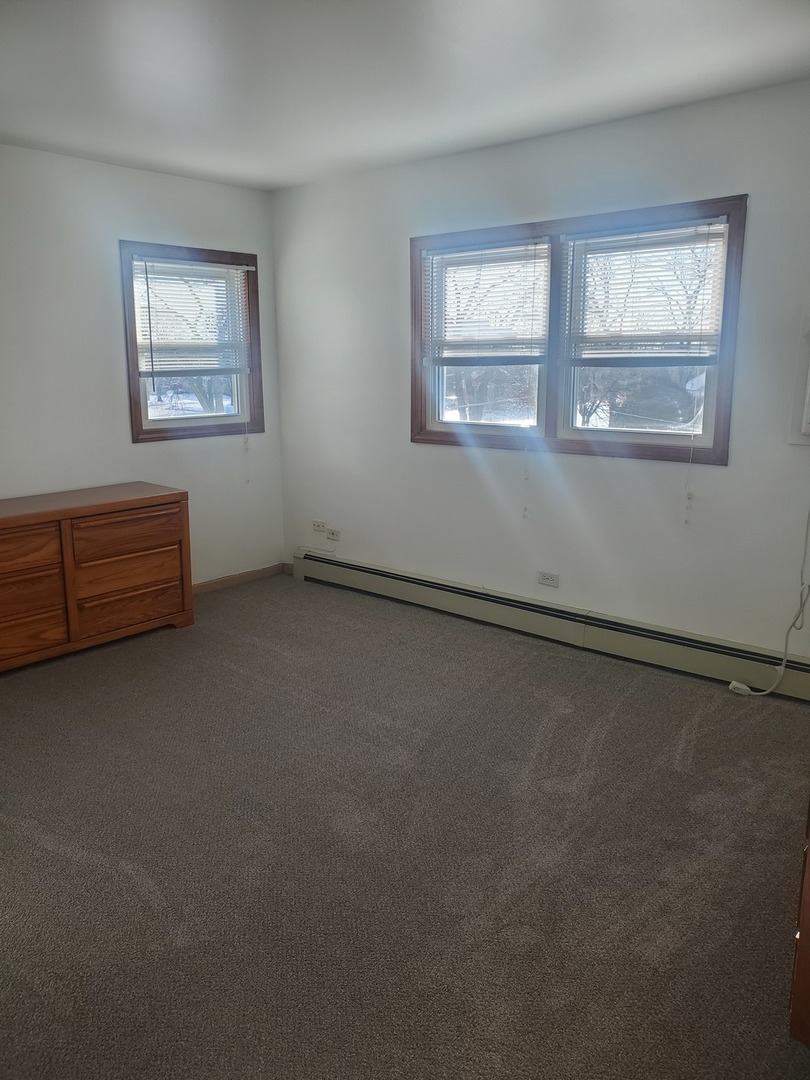 508 Ida Court, Unit 2 Mount Prospect, IL 60056 - Photo 10 of 13 a view of empty room with window
