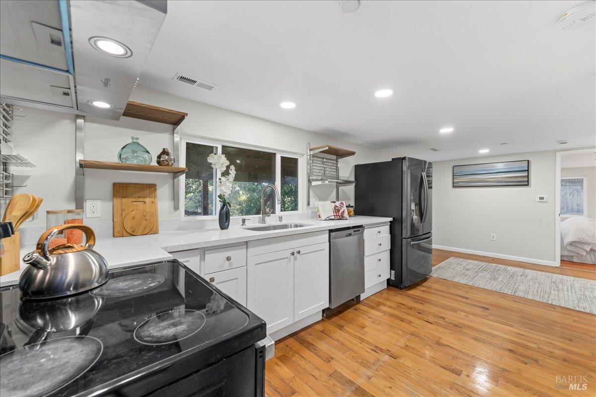 30 Fair Drive San Rafael, CA 94901 - Photo 20 of 33 a kitchen with stainless steel appliances granite countertop a sink and a refrigerator