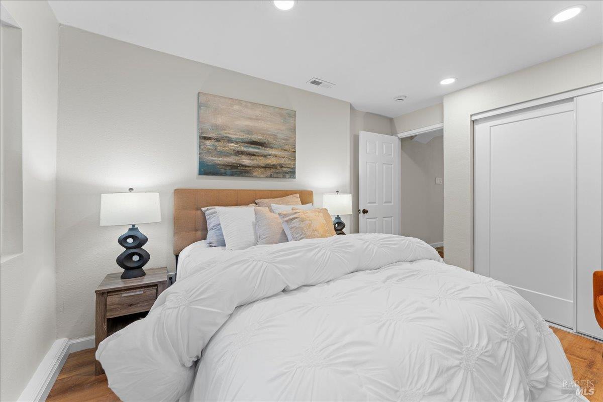 30 Fair Drive San Rafael, CA 94901 - Photo 29 of 33 a bedroom with a bed and a painting on the wall