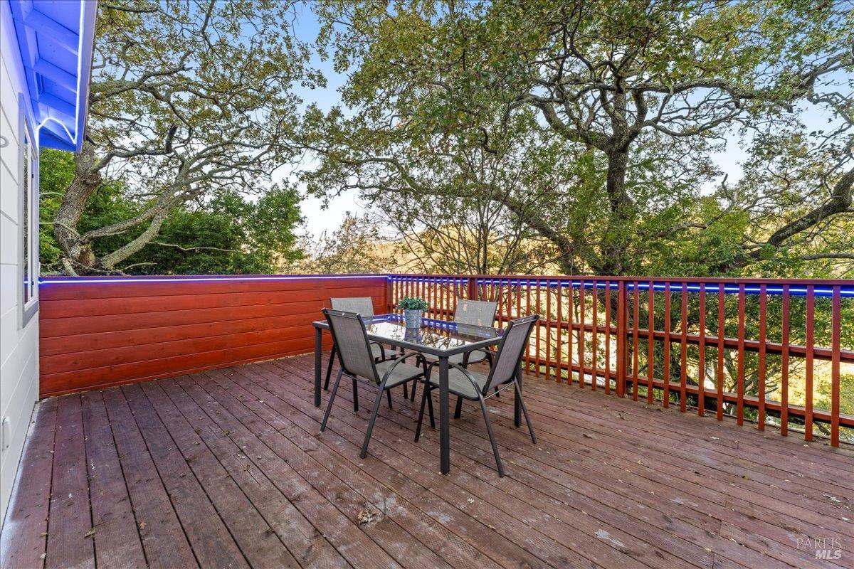 30 Fair Drive San Rafael, CA 94901 - Photo 31 of 33 a view of a roof deck with table and chairs and wooden floor