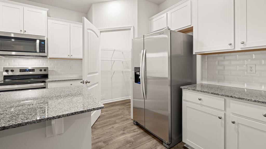 47 Rustin Ridge Dahlonega, GA 30533 - Photo 6 of 27 a kitchen with stainless steel appliances granite countertop a refrigerator a stove and a sink