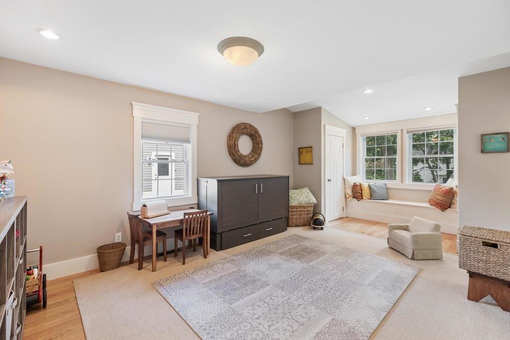 18 Moccasin Path Arlington, MA 02474 - Photo 17 of 33 a living room with furniture a window and a potted plant
