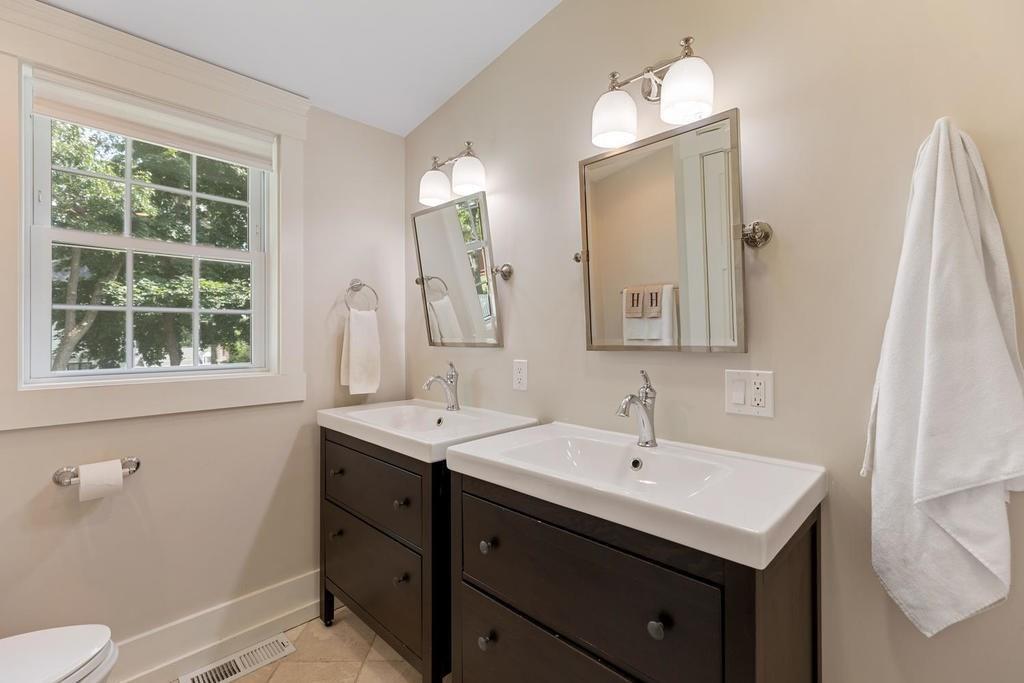 18 Moccasin Path Arlington, MA 02474 - Photo 19 of 33 a bathroom with a sink and a mirror