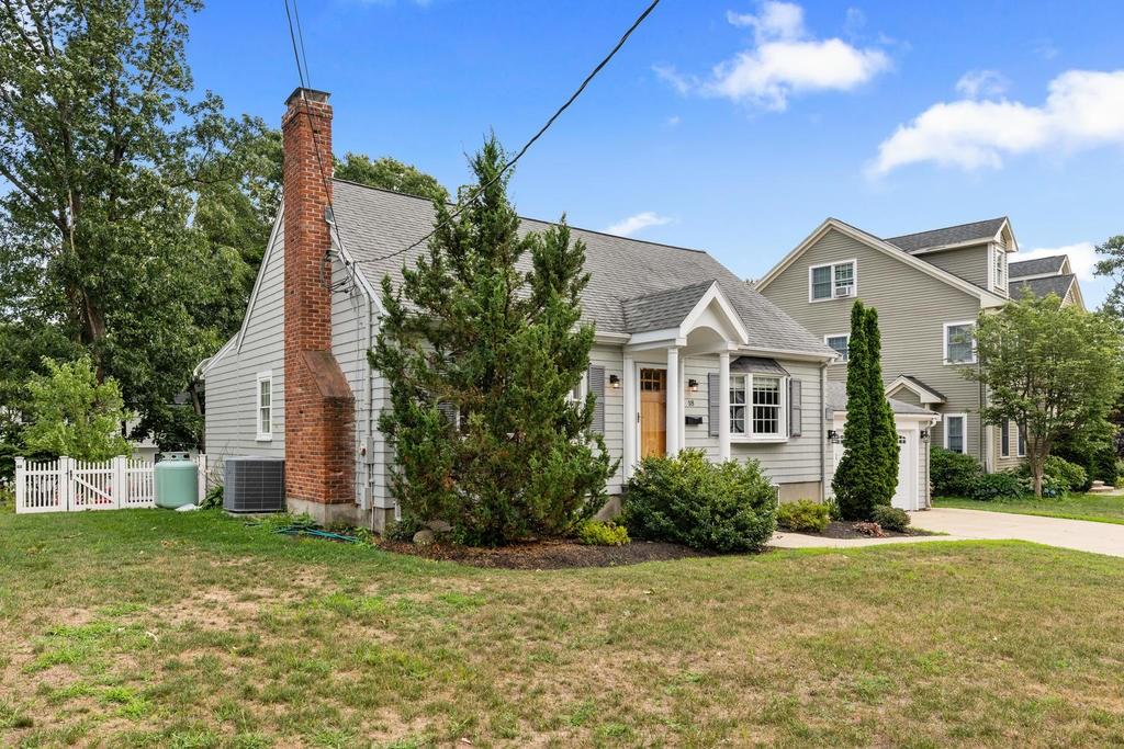 18 Moccasin Path Arlington, MA 02474 - Photo 2 of 33 a front view of a house with garden