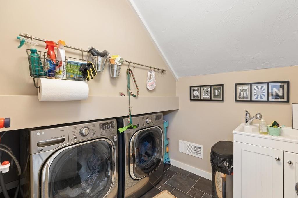 18 Moccasin Path Arlington, MA 02474 - Photo 21 of 33 a utility room with dryer and washer