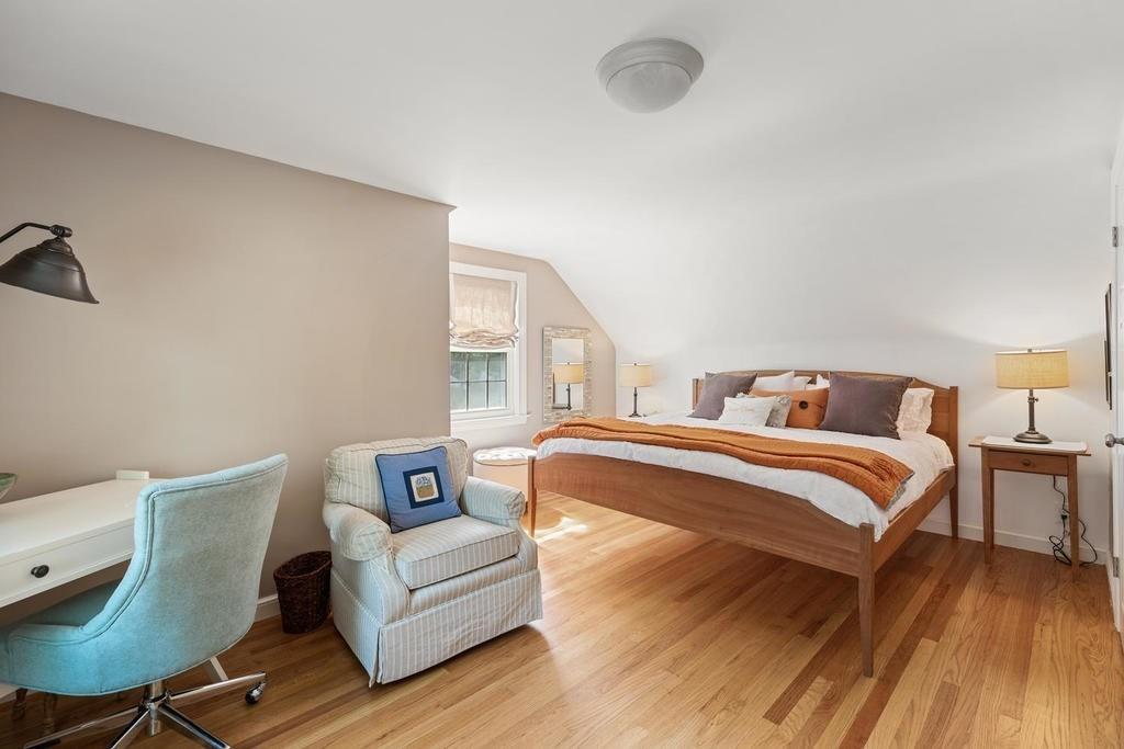 18 Moccasin Path Arlington, MA 02474 - Photo 22 of 33 a bedroom with a bed and wooden floor