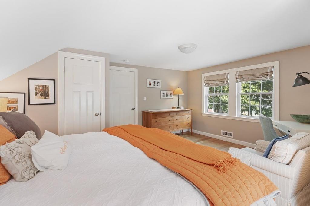 18 Moccasin Path Arlington, MA 02474 - Photo 24 of 33 a spacious bedroom with a large bed and a window