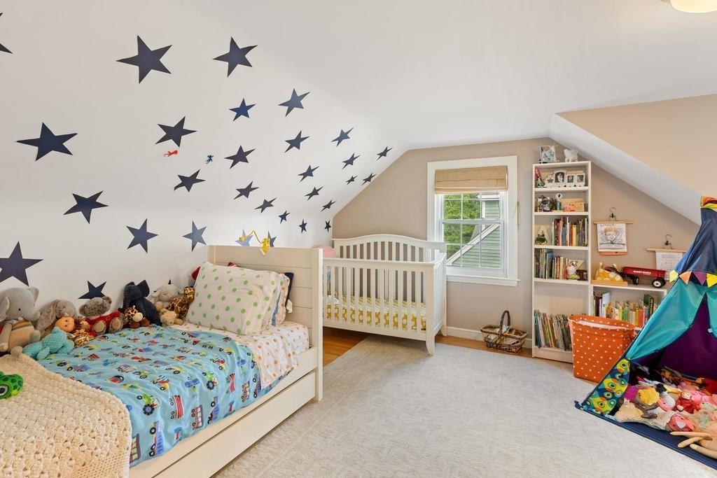 18 Moccasin Path Arlington, MA 02474 - Photo 26 of 33 a bedroom with furniture and a book shelf