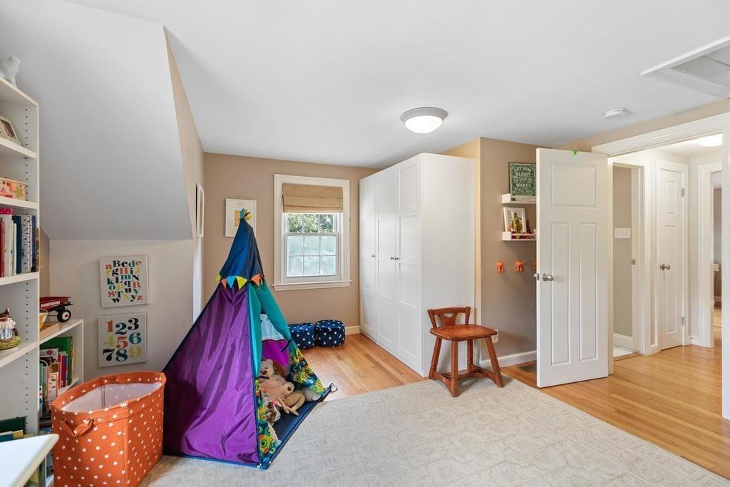 18 Moccasin Path Arlington, MA 02474 - Photo 27 of 33 a bed room with a bed and a window